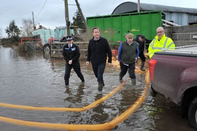 Prime Minister David Cameron with MP Ian Liddell-Grainger (3rd left) during a visit to Somerset. Photo: Tim Ireland/PA Wire