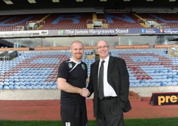 Sean Dyche and Gordon Rothwel celebrate the James Hargreaves Group agreeing a new three-year deal to sponsor the main stand at Turf Moor