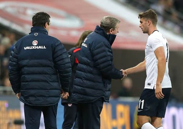 England manager Roy Hodgson (centre) shakes the hand of Jay Rodriguez after he is substituted during the International Friendly at Wembley Stadium, London. Photo: Peter Byrne/PA Wire.