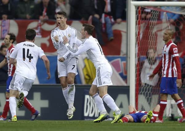 TOP MAN? Reals Cristiano Ronaldo celebrates his equaliser with Gareth Bale in the Madrid derby with Atletico at the Vicente Calderon stadium on Sunday