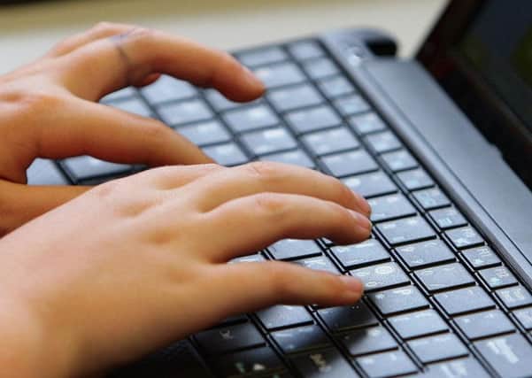 young person using a laptop. Photo: Dave Thompson/PA Wire