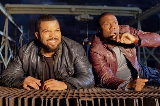 Undated Film Still Handout from Ride Along. Pictured: r-l Kevin Hart, Ice Cube. See PA Feature FILM Film Reviews. Picture credit should read: PA Photo/Universal Pictures. WARNING: This picture must only be used to accompany PA Feature FILM Film Reviews.
