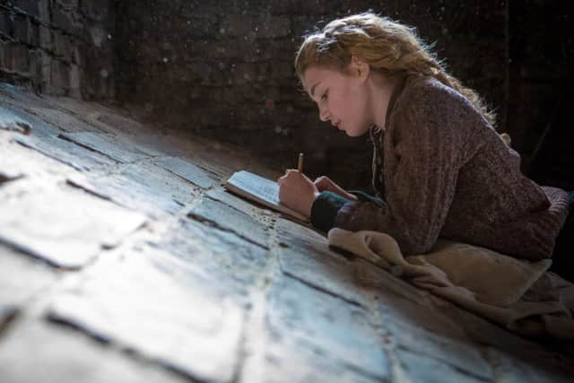 Undated Film Still Handout from The Book Thief. Pictured: Liesel (Sophie Nélisse).  See PA Feature FILM Film Reviews. Picture credit should read: PA Photo/Fox UK Film. WARNING: This picture must only be used to accompany PA Feature FILM Film Reviews.
