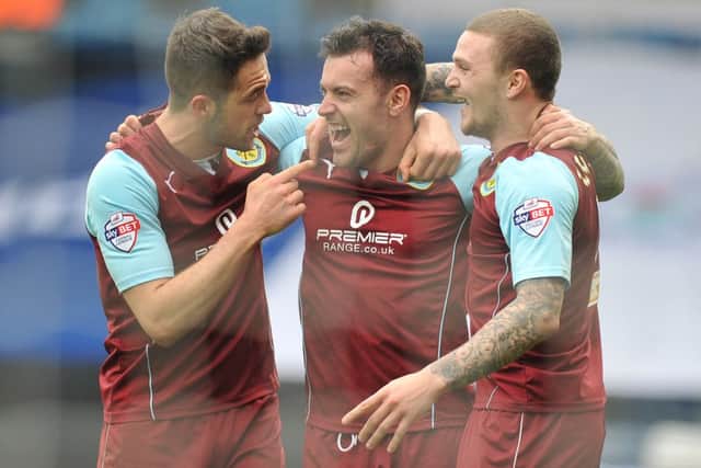 Danny Ings, Ross Wallace and Kieran Trippier celebrate at the final whistle