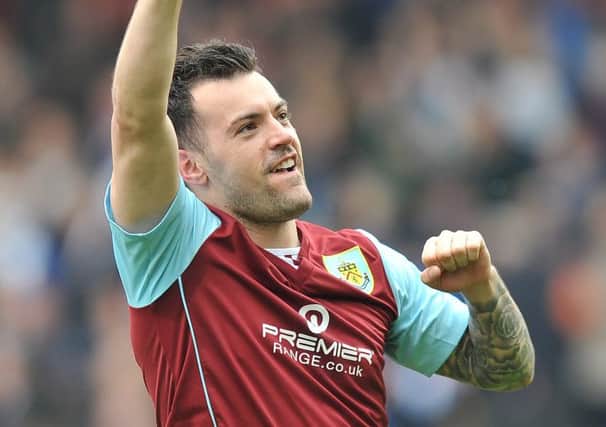 DERBY DELIGHT: Ross Wallace at the final whistle and (below) a Burnley fan enjoys his day out