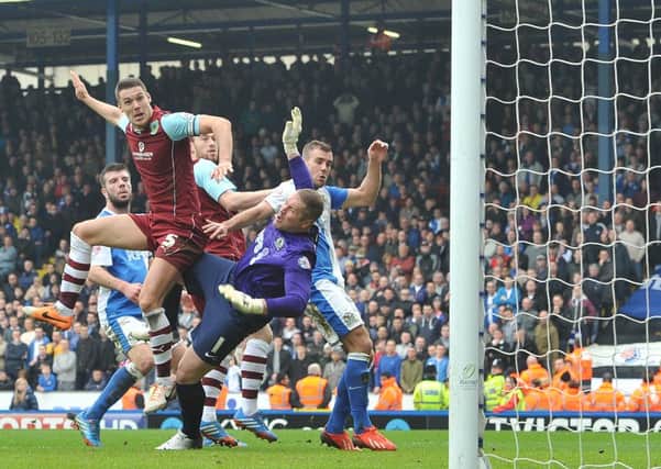 GET IN: Jason Shackell is as brave as a chicken as he heads Burnley level at Ewood Park.