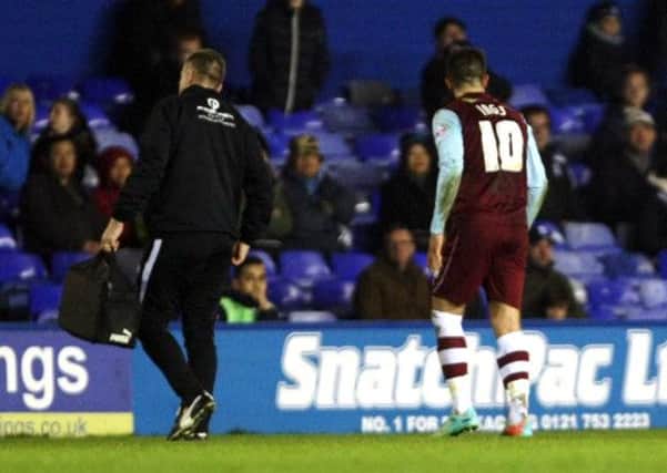 Anxious wait: Burnley await news of Danny Ings injury after he hobbled off after a poor challenge at Birmingham on Wednesday night