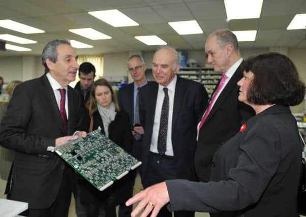 Business Secretary Vince Cable takes a tour around AMS Neve sound engineering company on Billington Road Industrial Estate.