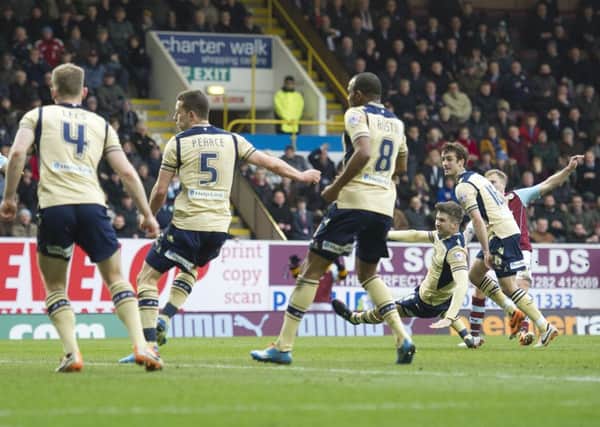 Match winner: Scott Arfield, far right, drives Burnley in front against Leeds United at Turf Moor on Saturday