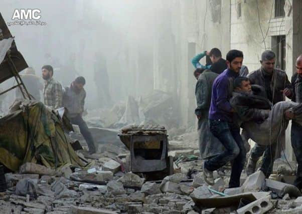 Scene of a Syrian government airstrike in Aleppo, Syria. (AP Photo/Aleppo Media Center, AMC)