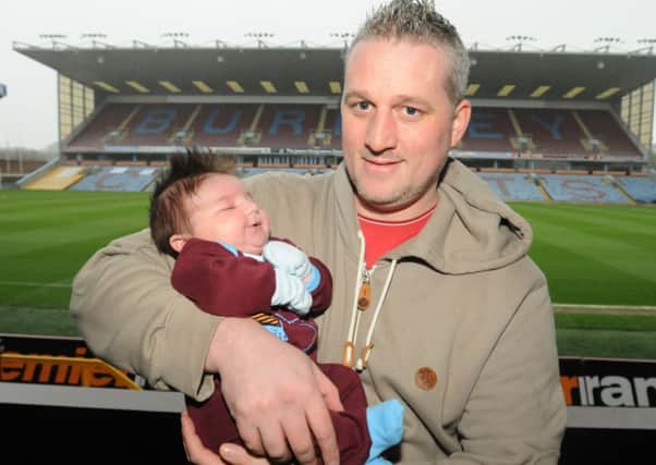Ben Walsh who got married at Turf Moor with his son Henry who has got his first season ticket.