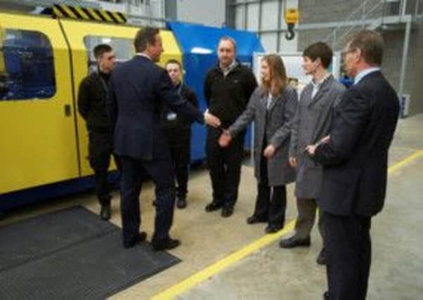 Mechanical engineering student Thomas Beetlestone meets and greets the Prime Minister David Cameron. (s)