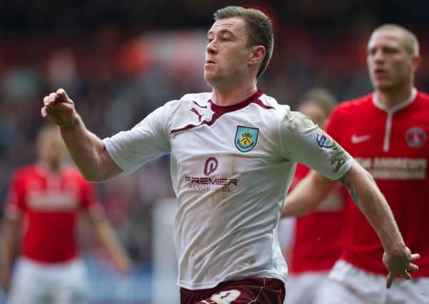 Keeping it smart: Ashley Barnes scored his first Burnley goal on Saturday and below a Smart car similar to the one Barnes drives around