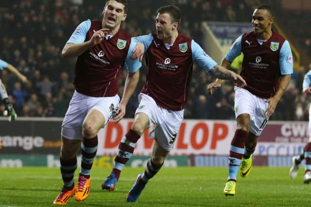 Sam Vokes celebrates putting Burnley ahead from the spot
