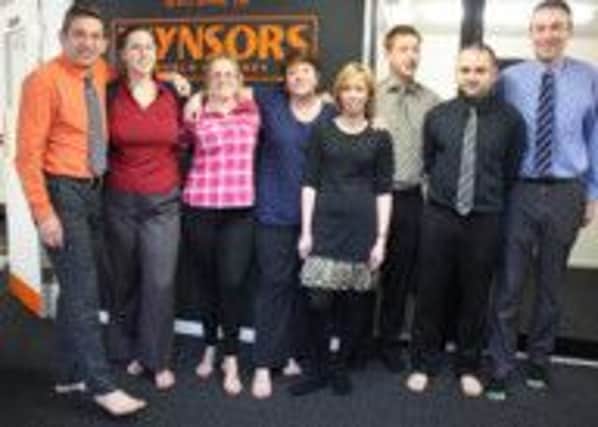 HAPPY FEET: Wynsors staff model the new Invisible Shoe