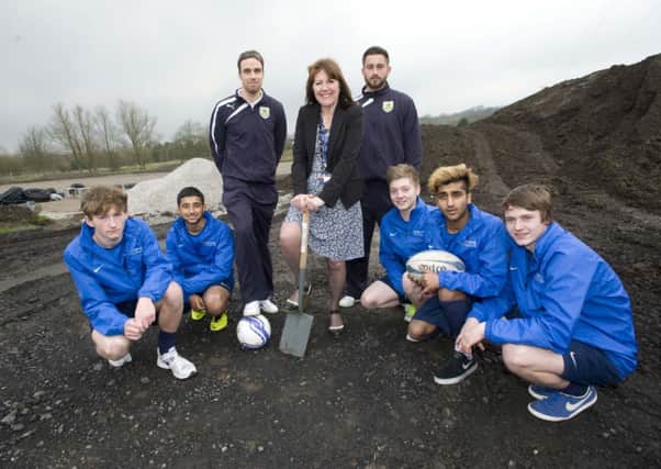 Photo Ian Robinson
Burnley FC players, Michael Duff and Alex Cisak with Nelson and Colne College principal Amanda Melton and football academy players during the sod cutting ceremony for the new high-tech sports pitch