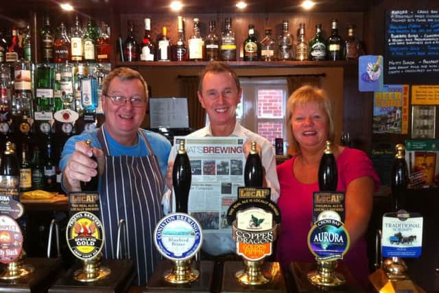 Nigel Evans MP (centre) with Steve and Christine Dilworth, licensees of the award-winning Swan With Two Necks, at Pendleton.