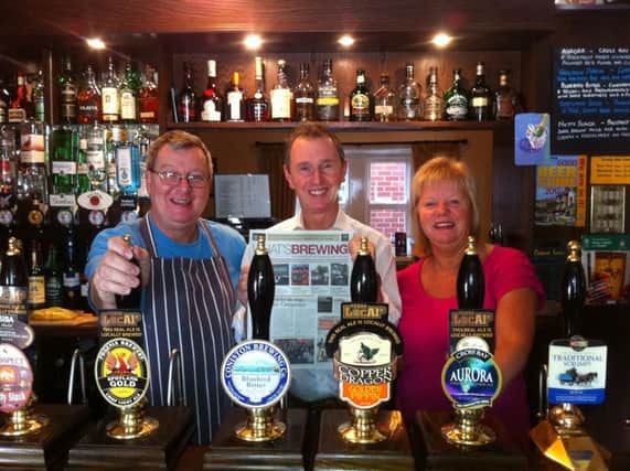 Nigel Evans MP (centre) with Steve and Christine Dilworth, licensees of the award-winning Swan With Two Necks, at Pendleton.