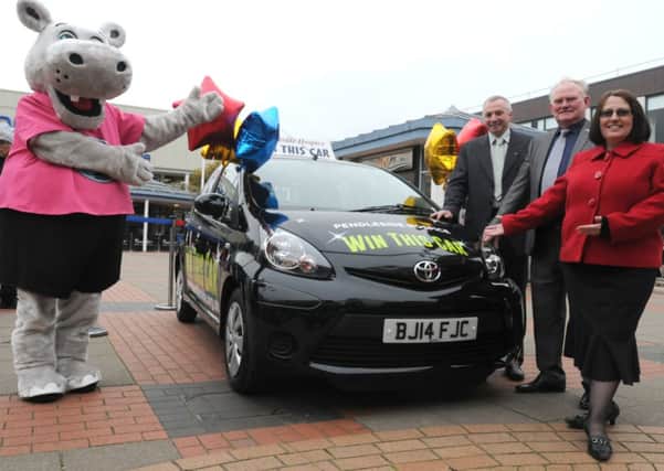 Hippo, Paul Thornton (Chairman of the District Freemasons), John Horan (Alderson and Horan) and Karen McIntyre with the Toyota Aygo.