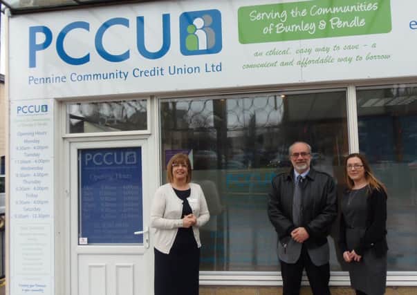Mr Brian Branch, president of the World Council of Credit Unions with Kathryn Fogg, PCCU manager, on left and deputy manager Ellie Morris on right (s)