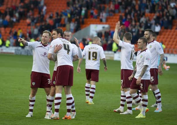 Burnley players celebrate their 1-0 win in front of the travelling fans