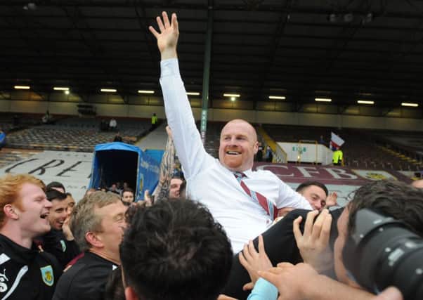 Sean Dyche celebrates winning promotion with his players