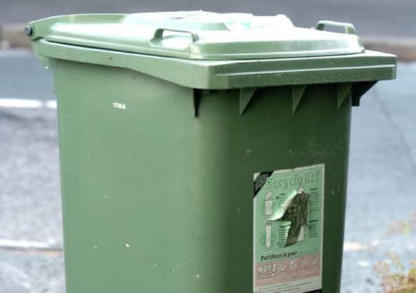 Green recycling wheelie bin