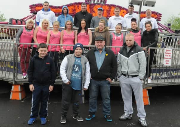 Family and friends of Lewis Taylor take part in a 'funfair-athon' challenge, going on as many rides as possible in an hour.