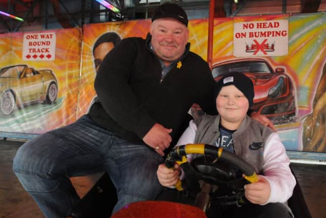 Gary Taylor and his son Lewis during the 'funfair-athon' challenge.
