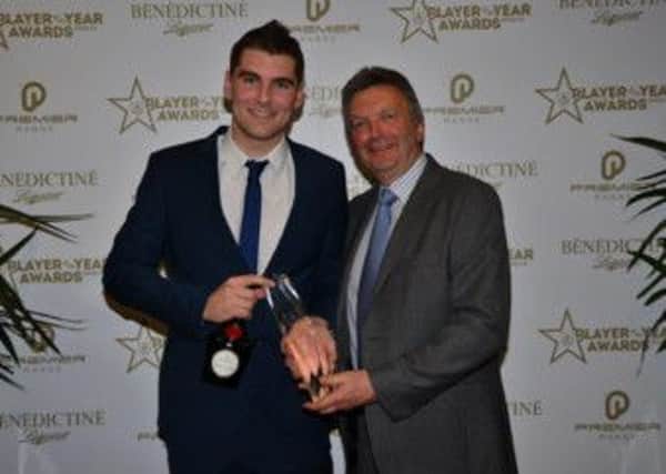 Sam Vokes is pictured with his Player of the Year award, along with Paul Curry from main sponsor, Benedictine