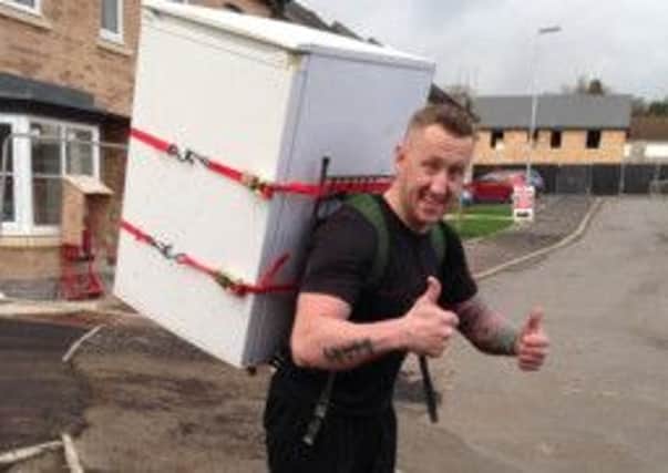 COOL Runnings: Former soldier Paul Tunstill is set to tackle the Pennine 10k with a fridge on his back. (s)