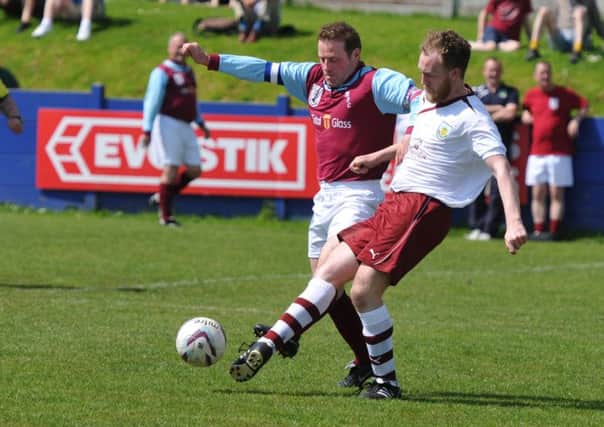 John Deary gets the better of Clarets Mads Danny Pollard
