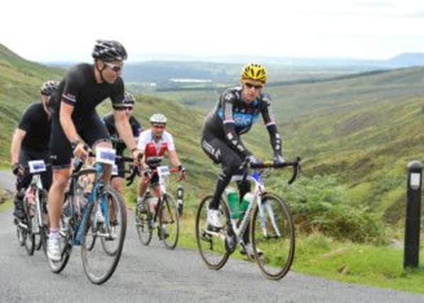 Sir Bradley Wiggins during the inaugural "Ride with Brad" in 2012 after his Tour de France and Olympic successes. (S)