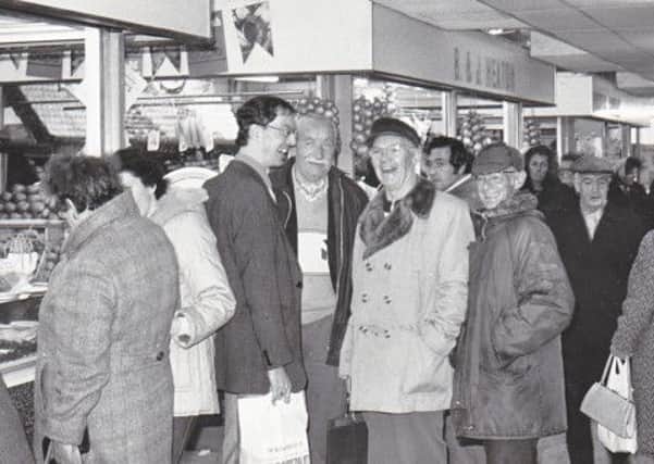 BARGAIN HUNTERS: Colne Market Hall characters, 1980. (S)