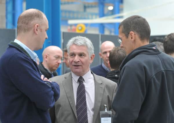 John Bennett from Marshall Aerospace and Defence Group, centre, at the opeing of the Kaman Tooling factory.