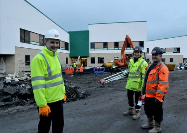 The new Clitheroe Community Hospital building as it was taking shape. Project manager Craig Henderson with builders James Wheeler and Graham Gaskell.