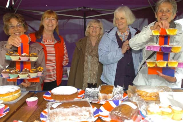 Members of Read Mothers' Union with a selection of cakes for sale at the garden fete.