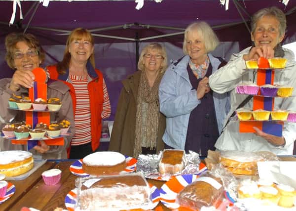 Members of Read Mothers' Union with a selection of cakes for sale at the garden fete.