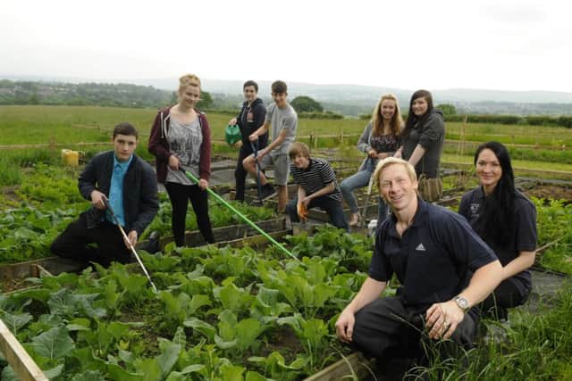 Former Olympic gymnast Craig Heap has created 150 community allotments at a beauty spot in Greenhead Lane, with his wife Emma and members of Burnley Boys and Girls' Club. Photo Neil Cross
