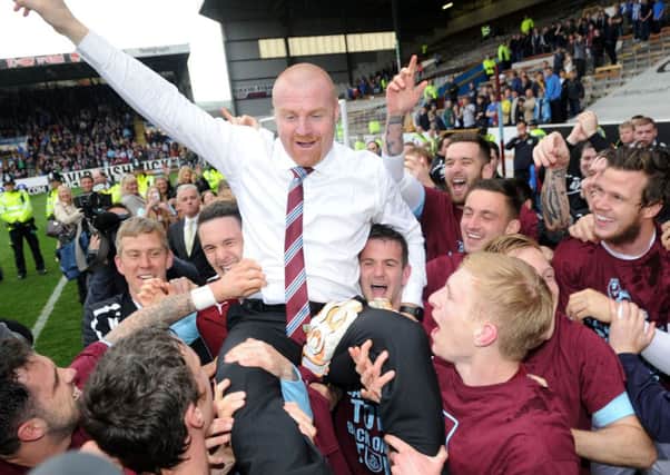Burnley's manager Sean Dyche celebrates after his side win promotion to the Premier League. Photo: Clint Hughes/PA Wire.
