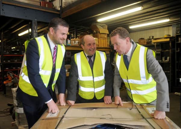 from left, MP for Pendle, Andrew Stephenson, Bill Leach CEO at Kirk Environmental and Greg Barker, Minister for energy during his visit to Kirk Environmental in Nelson