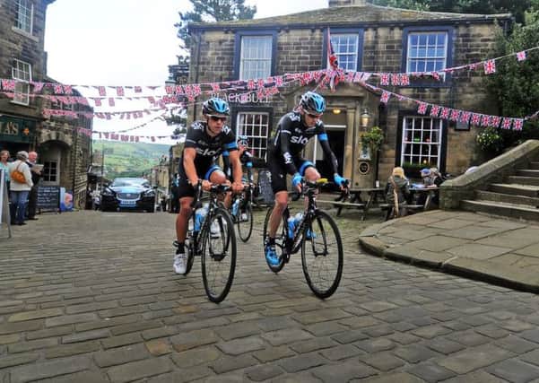 Team Sky cyclists Richie Porte and Chris Froome ride up the cobbles in Haworth on a recce for Stage 2 of the Tour de France in Yorkshire. TJ100380b Picture by Tony Johnson