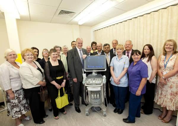 Happy day: Gordon hands over new prostate scanner