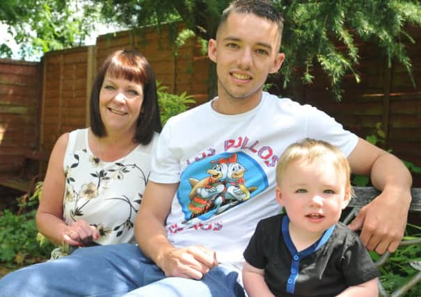 TRANSPLANT HOPES: Nathan Barrett who is in desperate for a lifesaving kidney transplant with his son Corby (15 months) and mum Karin.