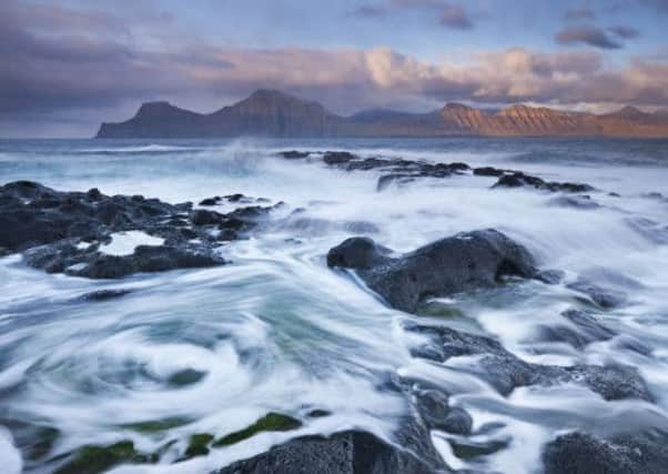 Surging waves break over the rocky shores at Gjogv on the island of Eysturoy. Photo:  Adam Burton Organisation