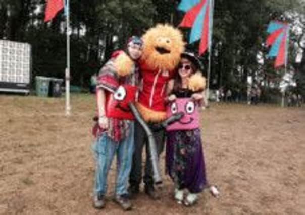 Revellers dress up in Henry the Hoover and Honey Monster costumes at this year's Beat Herder.