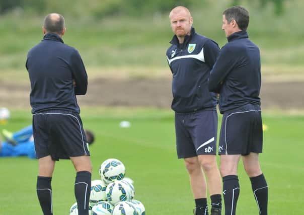 Thirsty work: Burnley boss Sean Dyche was pleased with his players efforts in sweltering conditions in Austria on Sunday