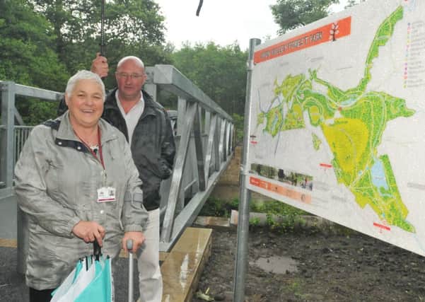 County Coun. Marcus Johnstone and Coun. Bea Foster open the new  bridge in the Brun Valley Forest Park