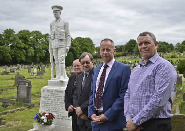 At the restored memorial to Pte James Booth, left to right: Mr Craig Simpson, Mr Cameron Collinge, manager at Burnley Cemetery, Mr Andrew Brown, Crow Wood Leisure, and  Mr Bill Hedley, Stone Edge (s).