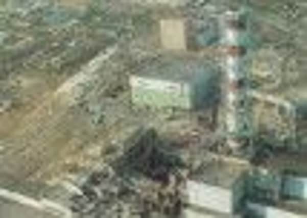 Chernobyl Disaster Aftermath: very extensive damage to the main reactor hall (image center) and turbine building (image lower left ).